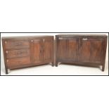 A pair of unusual 20th century hardwood sideboard cabinets of hardwood construction being raised
