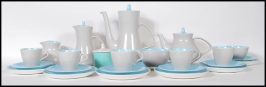 A mid century retro Poole pottery tea service in a blue and mushroom grey colourway. To include