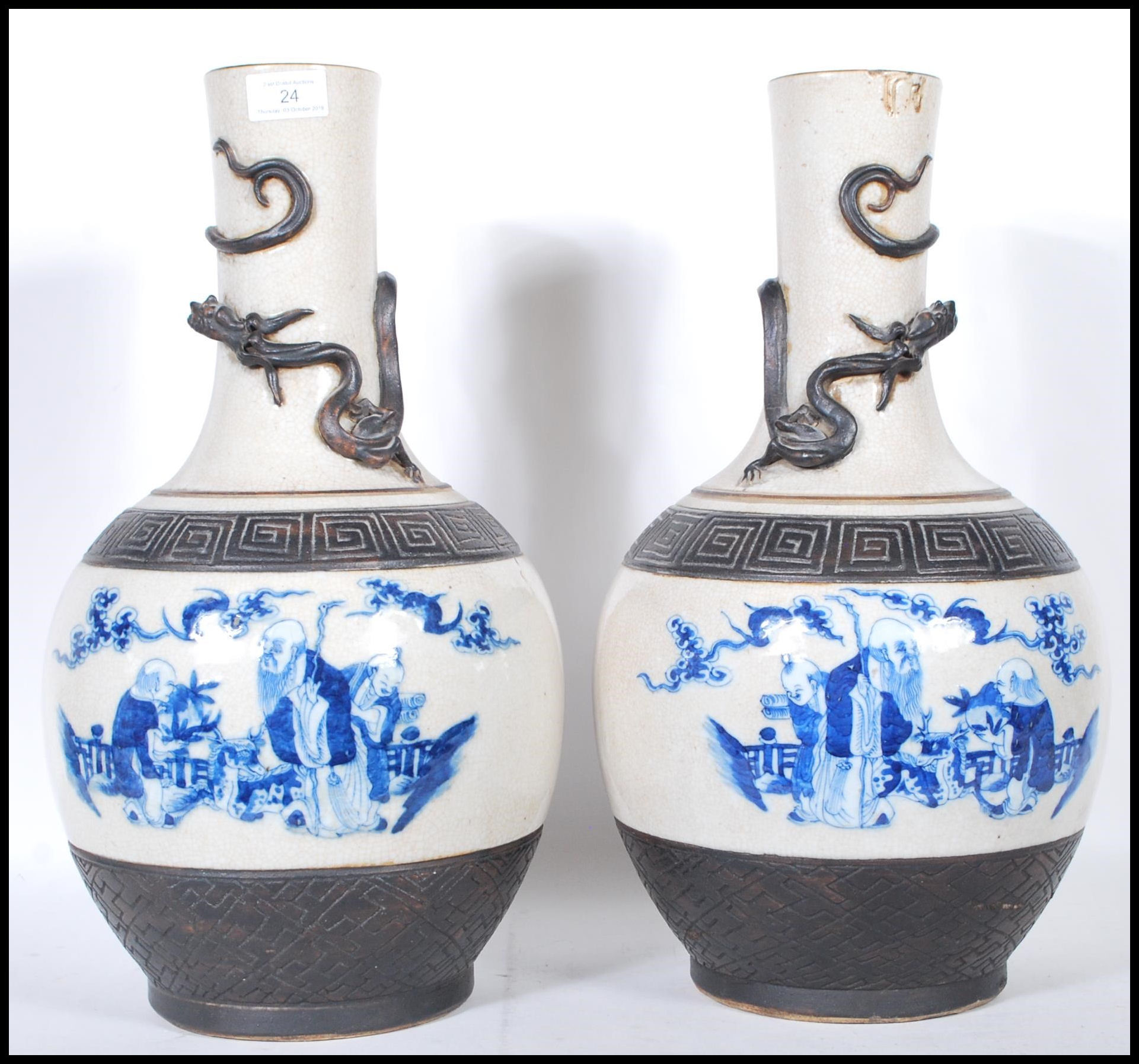A pair of late 19th Century tall crackle glaze vases of baluster form, each with a panel to the