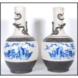 A pair of late 19th Century tall crackle glaze vases of baluster form, each with a panel to the