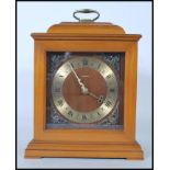 A 20th Century walnut cased Smith's ' Tempora ' bracket clock with brass dial and Roman numeral