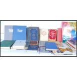 A collection of reference books from across the years on various subjects to include The New