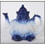 An early 20th Century Staffordshire ceramic teapot in the form of a Toby character. The teapot