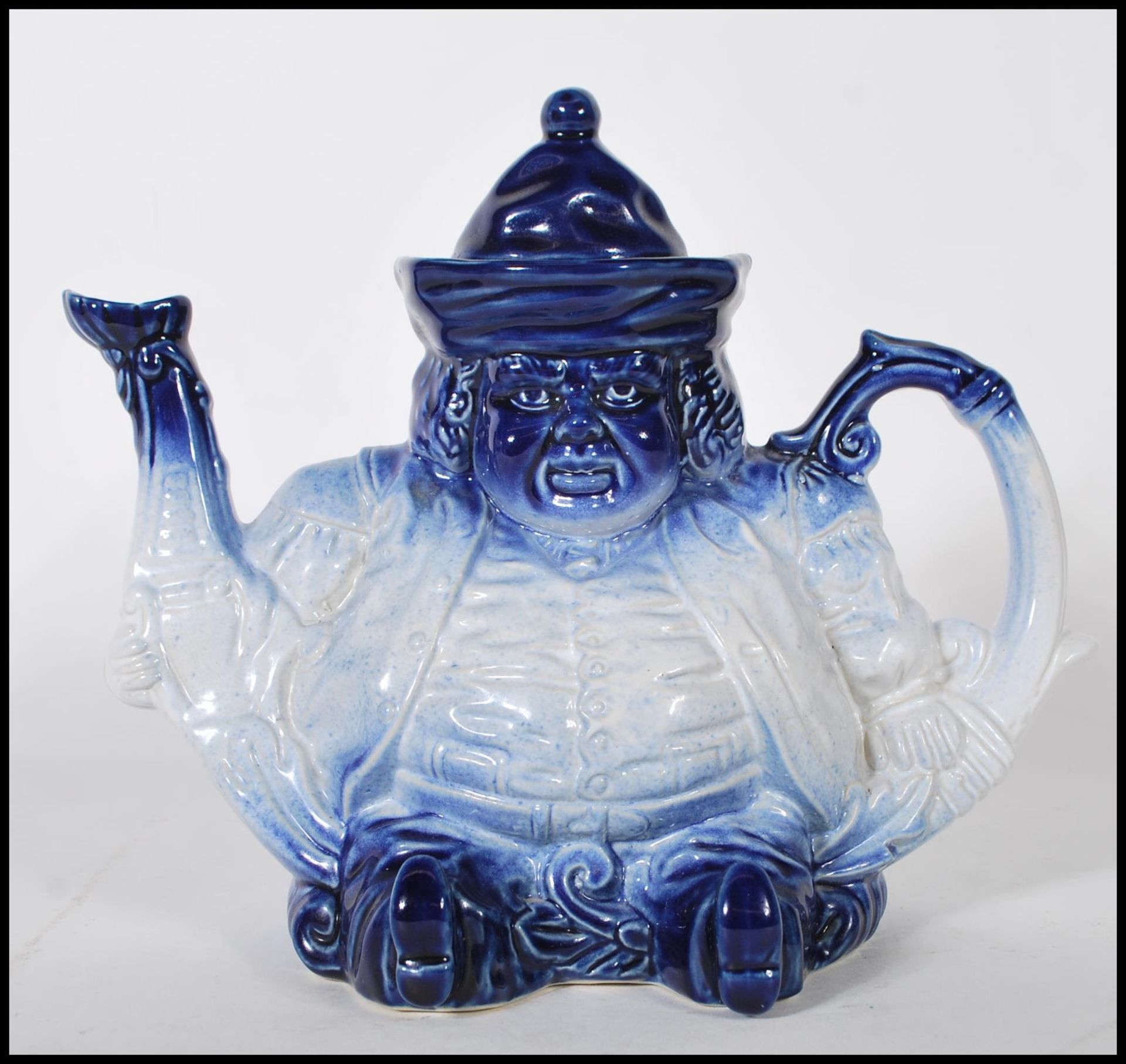 An early 20th Century Staffordshire ceramic teapot in the form of a Toby character. The teapot