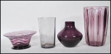 A selection of mid 20th Century retro amethyst purple glass to include a footed bowl of flared