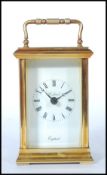 A St James 20th century century brass cased carriage clock with roman numeral chapter ring and
