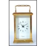 A St James 20th century century brass cased carriage clock with roman numeral chapter ring and