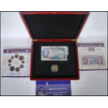 BRITANNIA THE COIN AND BANKNOTE TRIBUTE SET with a certificate, in a fitted case, blue Bank of