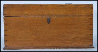 A 19th century Victorian pine bible box having a lock to front. The hinged lid opening to reveal a