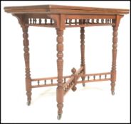 A late 19th Century Victorian card table, fold over baize lined top with gallery frieze raised on