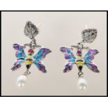 A pair of silver and enamel set drop earrings in the form of butterfly's having plique a jour