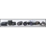 A Praktica Super TL 3 film camera body with a Pentacon auto 1.8/50, a Cimko MT Series 1:5.6 100-