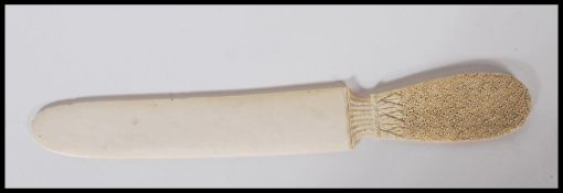 A 19th Century Chinese Cantonese ivory page turner / letter opener / paper knife having profusely