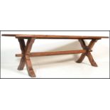 An excellent solid oak monastic refectory dining table in the Jacobean manner of long, large form.