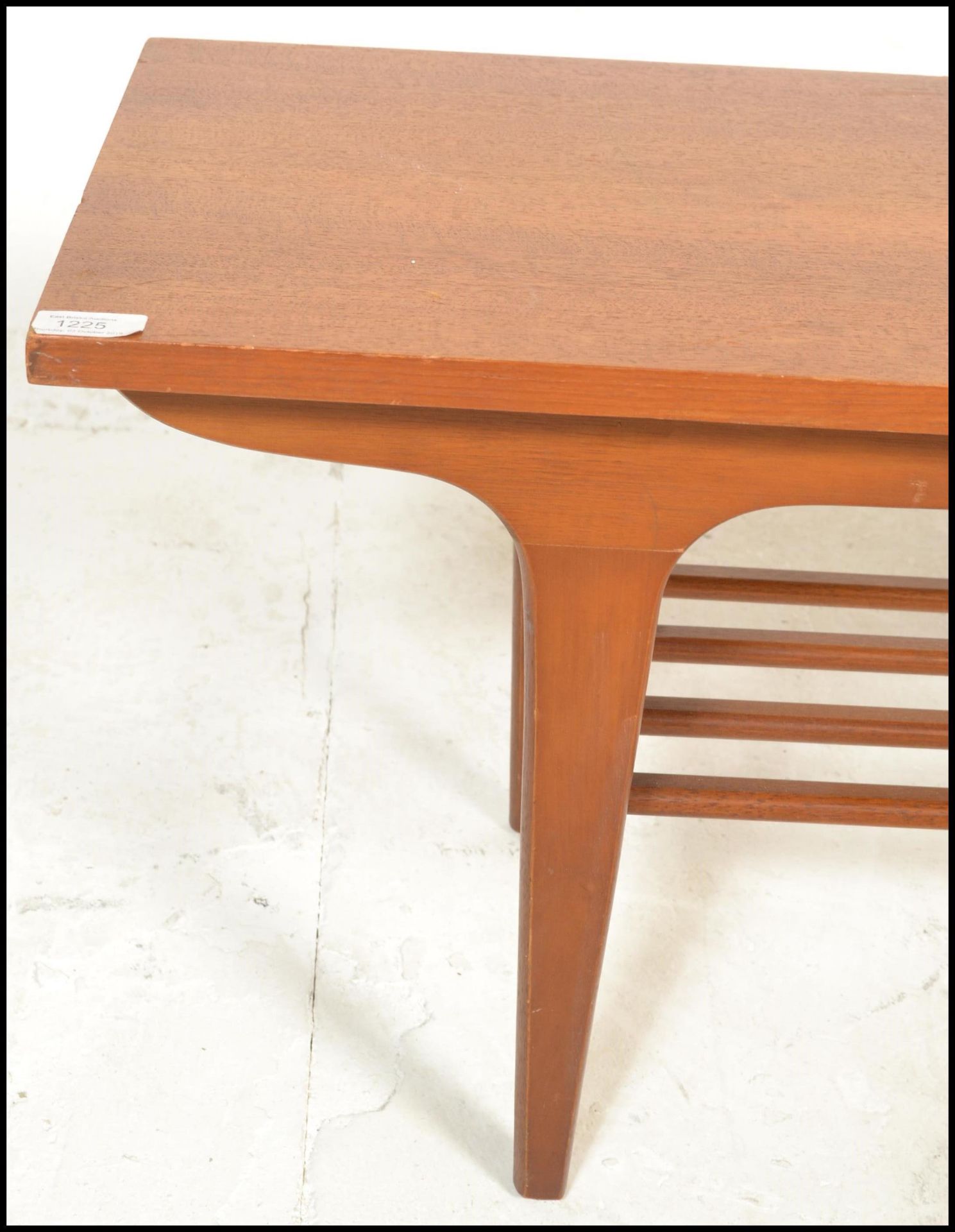 A mid century Danish influence teak wood long john coffee table being raised on tapering legs with a - Image 7 of 8