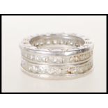 A silver Bvlgari ladies dress ring set with two layers of square cut white stones, inscribed Bvlgari