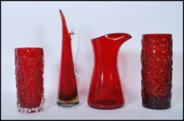 A group of four mid 20th Century vintage retro studio ruby red glass vases to include two bark