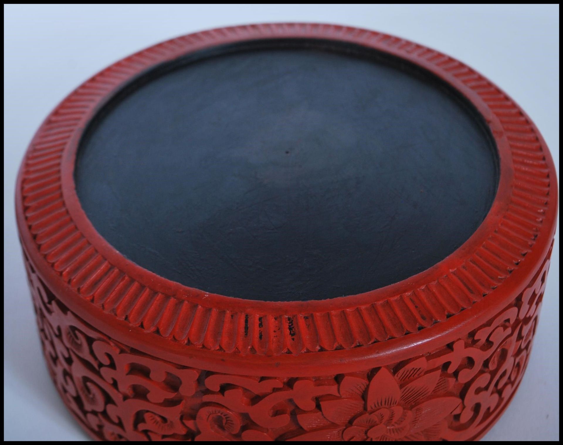 A 20th Century Chinese Cinnabar round desk top box of round form having carved relief of a Chinese - Image 7 of 7