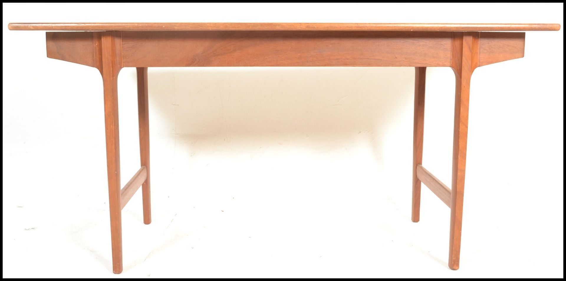A mid century Bath Cabinet Makers teak wood Danish inspired dining table being raised on turned, - Image 3 of 7