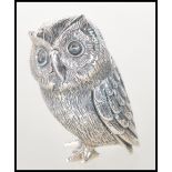A sterling silver novelty figurine of an owl. Stamped to the base Sterling. Weighs 18g. Measures 4cm