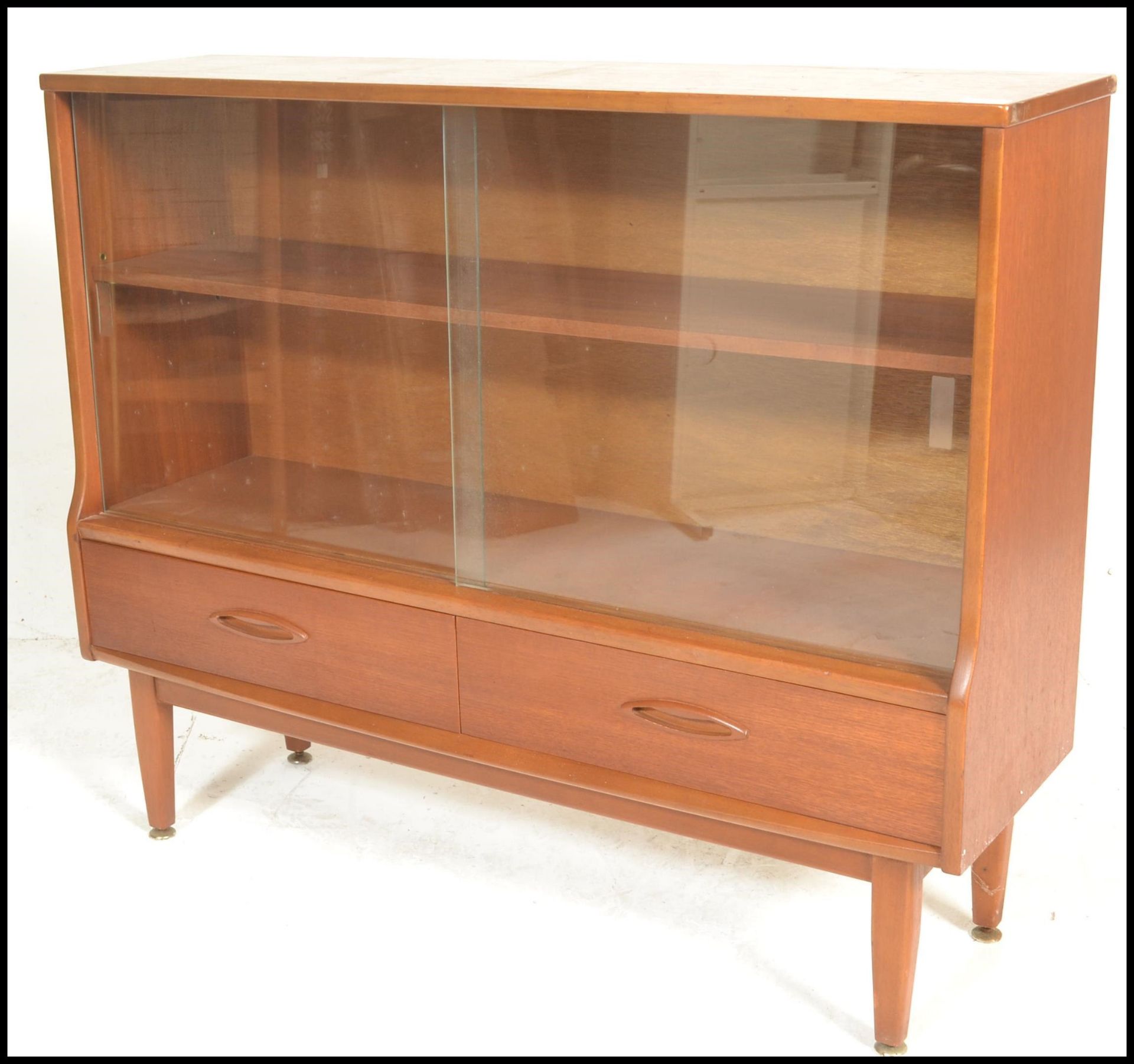 A retro 20th Century teak wood display cabinet having twin glass sliding doors with a shelved - Image 4 of 5