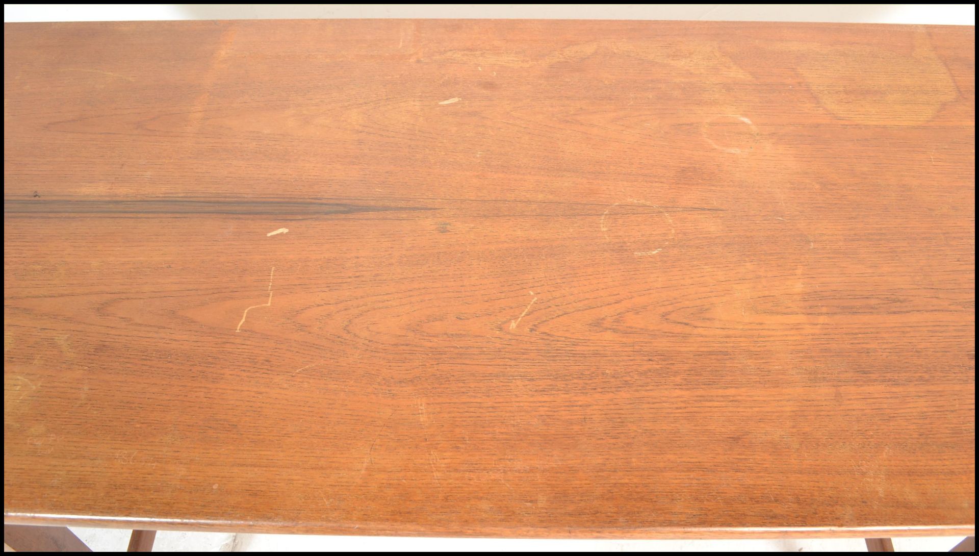 A mid century Bath Cabinet Makers teak wood Danish inspired dining table being raised on turned, - Image 2 of 7