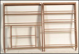 A near pair of 20th Century oak wall hanging sectional open display shelves, the shelves with a