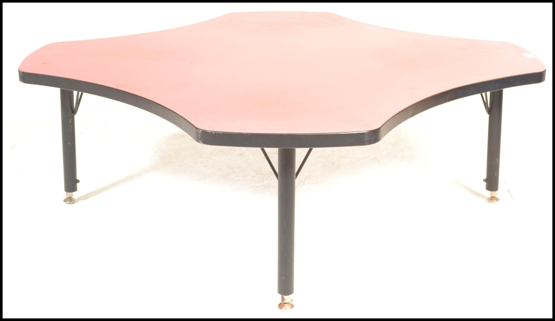 A 20th Century retro coffee table of square form having concave sides to the red top with ebonised - Bild 3 aus 4