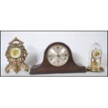 An early 20th century gilt metal mantel clock with rococo design together with a 1920's Napoleons