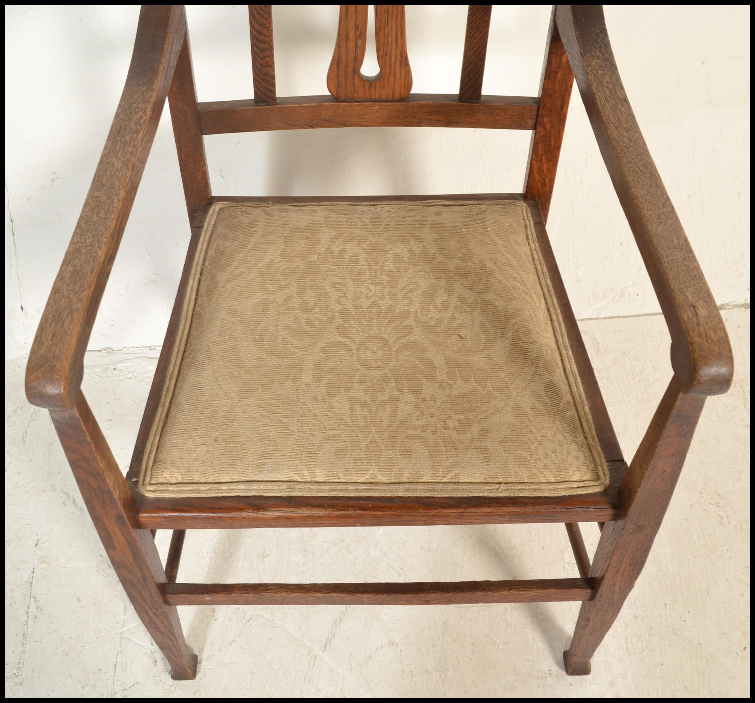 A late 19th / early 20th Century Art Nouveau oak elbow chair, pierced backrest over carved splatback - Image 3 of 5