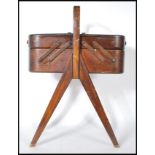 A vintage retro 20th Century teak wood multi sectional cantilever work box / sewing box, metamorphic