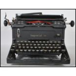 A vintage 20th Century Imperial 58 industrial typewriter, black silvered buttons, makers mark to the