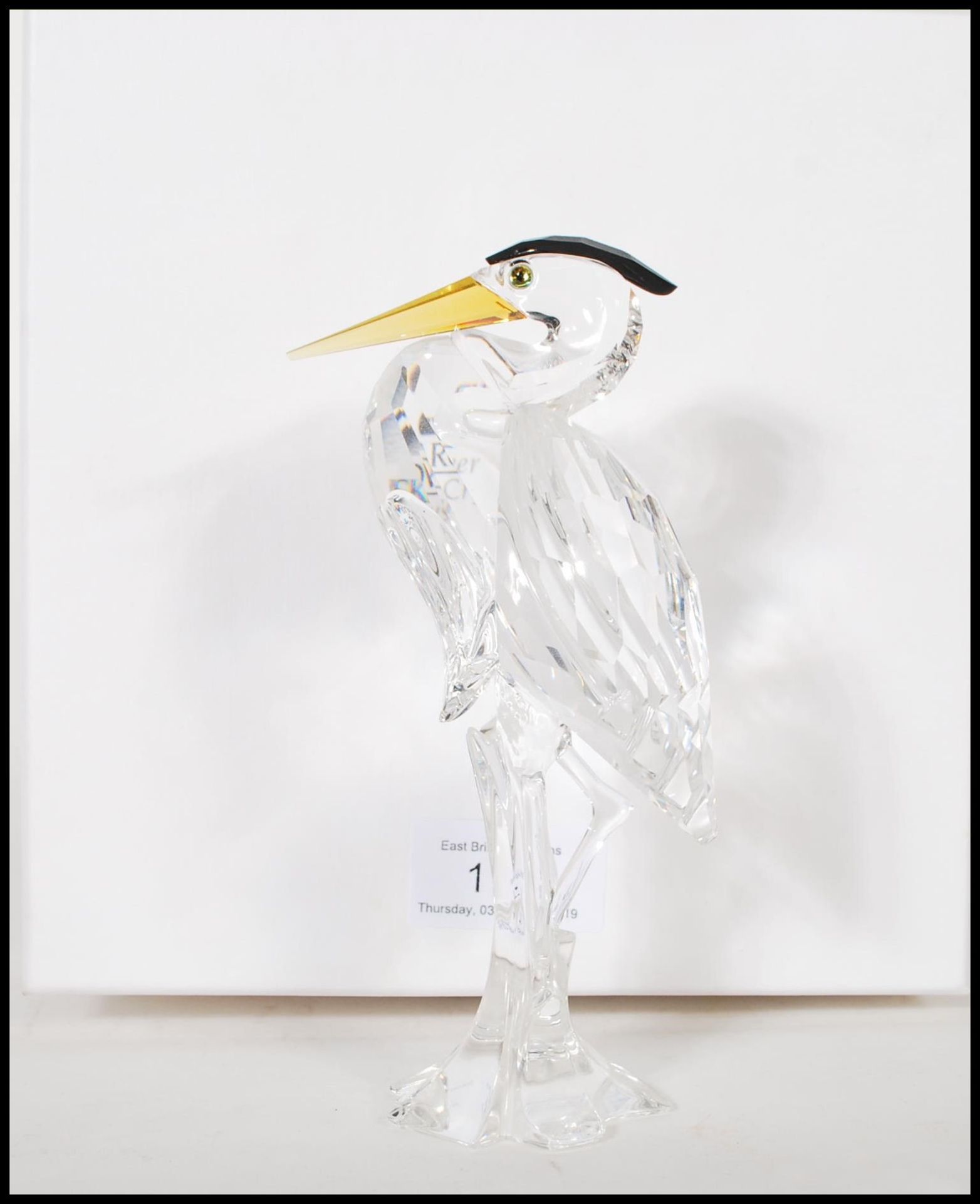 Swarovski - Silver Crystal - a cut glass crystal figurine of a Heron / crane raised on a