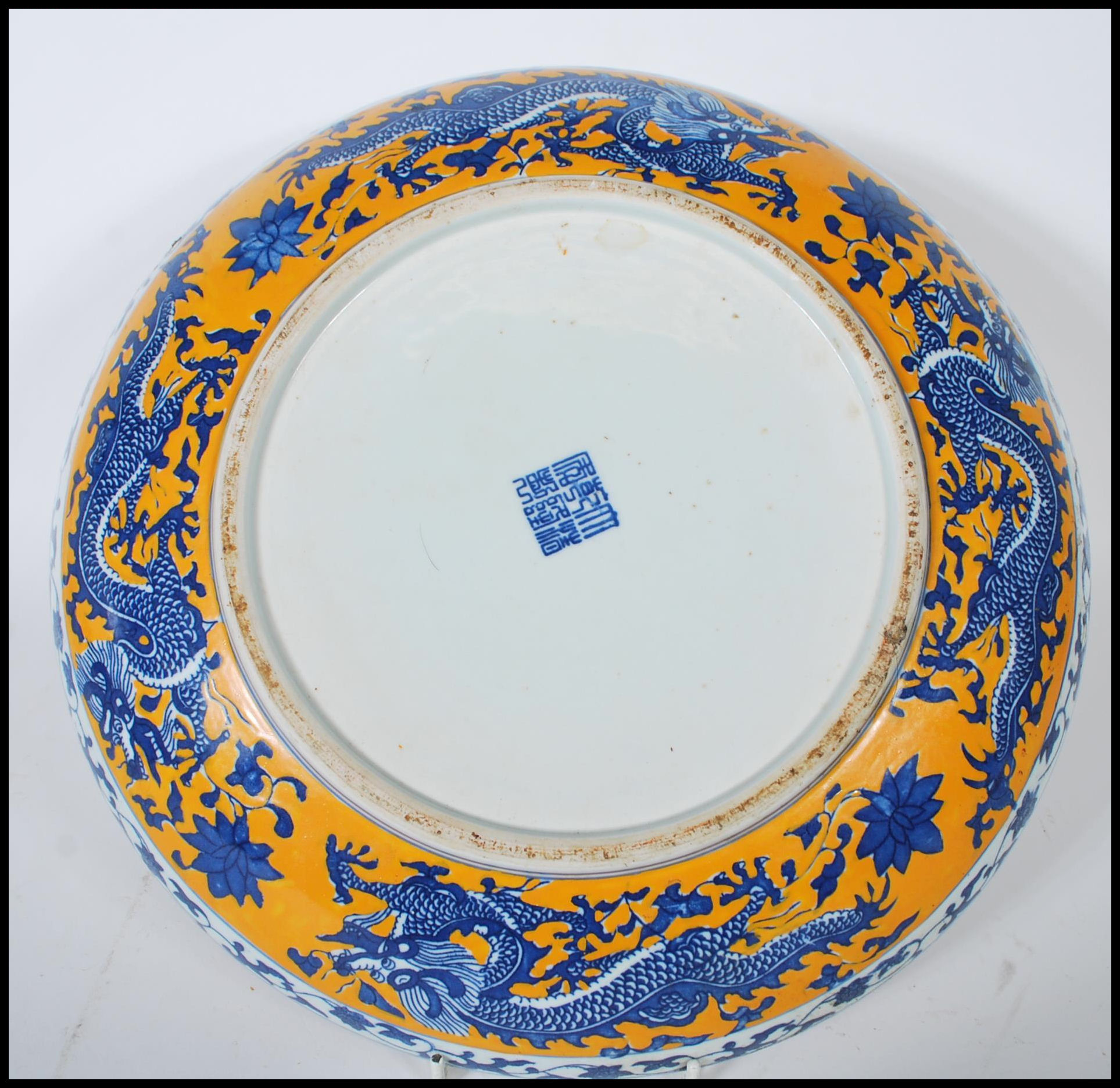 A 20th Century Chinese wall charger having hand painted on a yellow ground with five toed blue and - Image 4 of 6