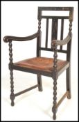A good 19th Century carved ebonised oak bobbin open framed armchair / desk chair, carved open