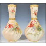 A pair of  Royal Worcester blush ivory vases, with conical necks and wrythen body, decorated with