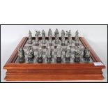 A collectors Danbury Mint Royal Selangor chess set entitled ' The Camelot Chess Set' consisting of