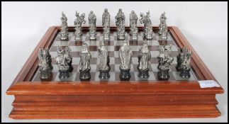 A collectors Danbury Mint Royal Selangor chess set entitled ' The Camelot Chess Set' consisting of