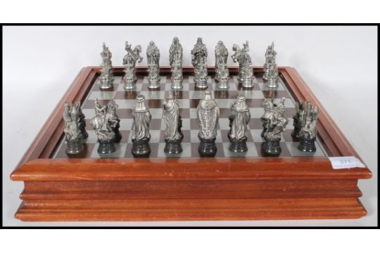 A collectors Danbury Mint Royal Selangor chess set entitled ' The ...
