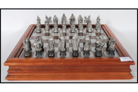 A Collectors Danbury Mint Royal Selangor Chess Set Entitled The a-collectors-danbury-mint-royal-selangor-chess-set-entitled-the