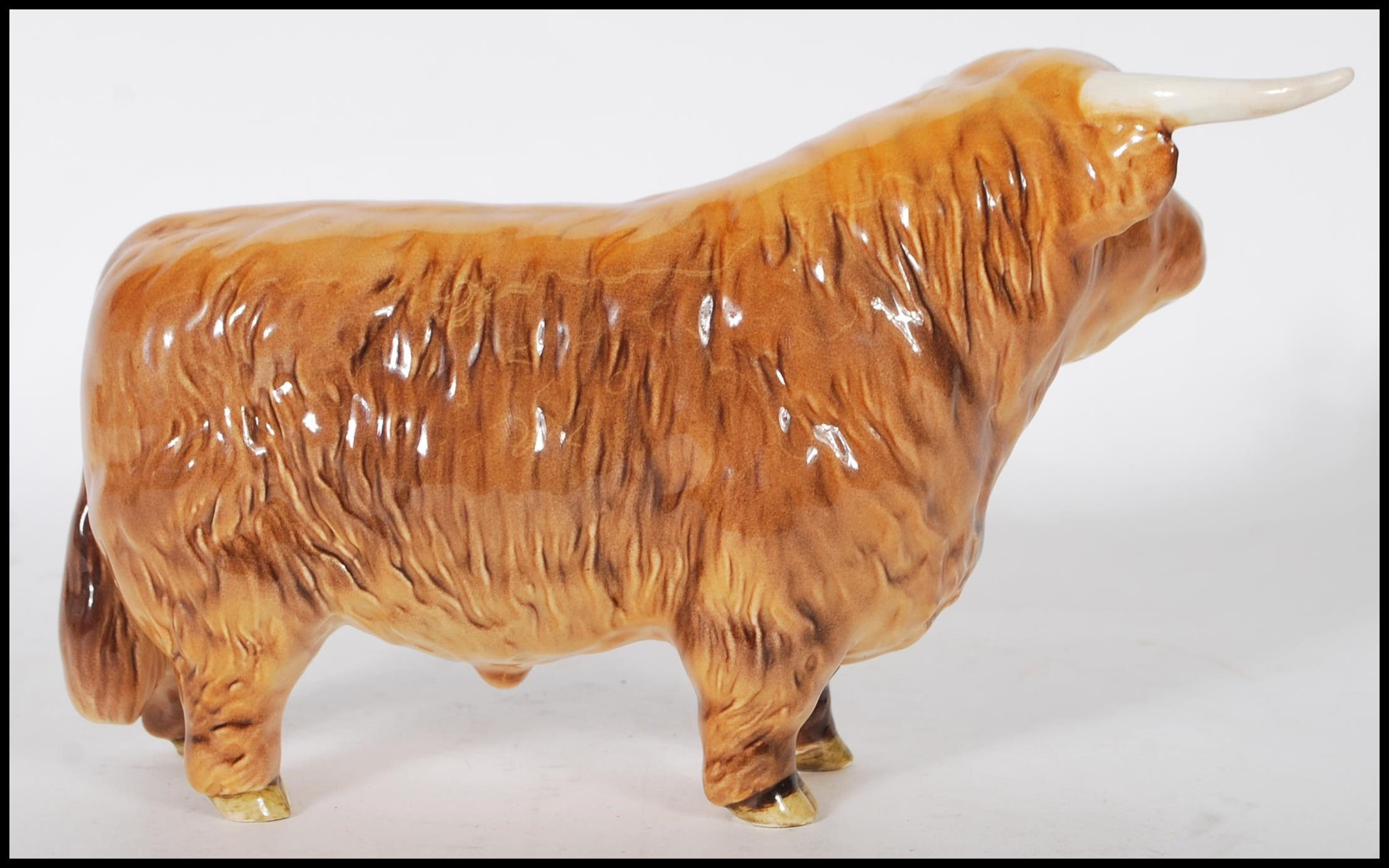 A Beswick ceramic figurine of a Highland cattle bull being stamped for Beswick, England to the foot. - Image 4 of 7