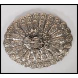 A continental silver ladies dressing table palm mirror. The hand mirror with silver leaves and