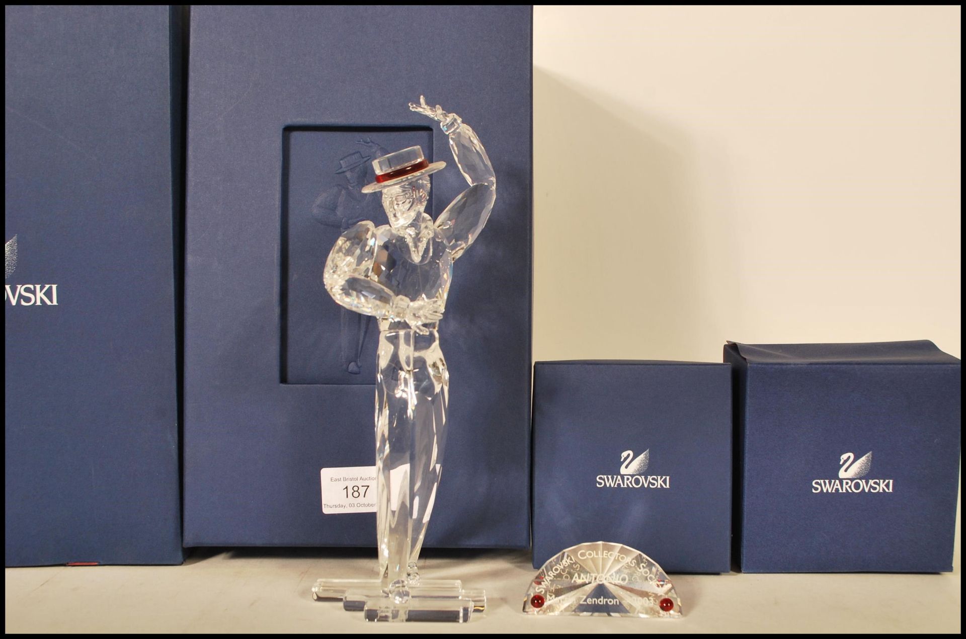 A large Swarovski cut glass crystal figurine in the form of a flamenco dancer with his arms posed,