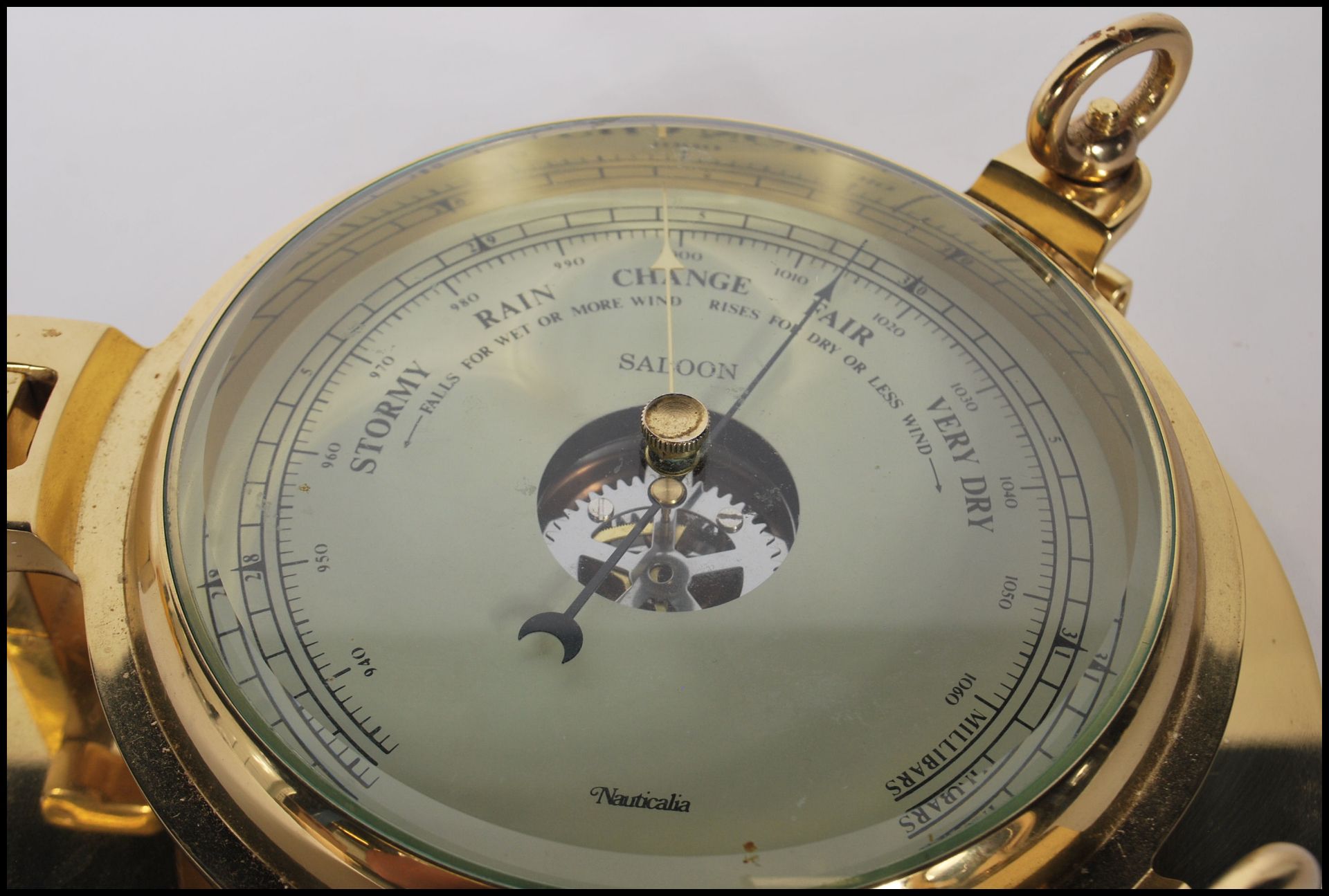 A contemporary 20th Century brass cased wall mounted ships barometer in the form of a porthole. - Image 3 of 5