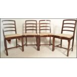 A set of four 1960's vintage afromosia (African teak) dining chairs by Richard Hornby for Heals, the