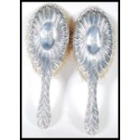 A pair of Victorian 19th Century silver hallmarked ladies clothes brushes by William Comyns