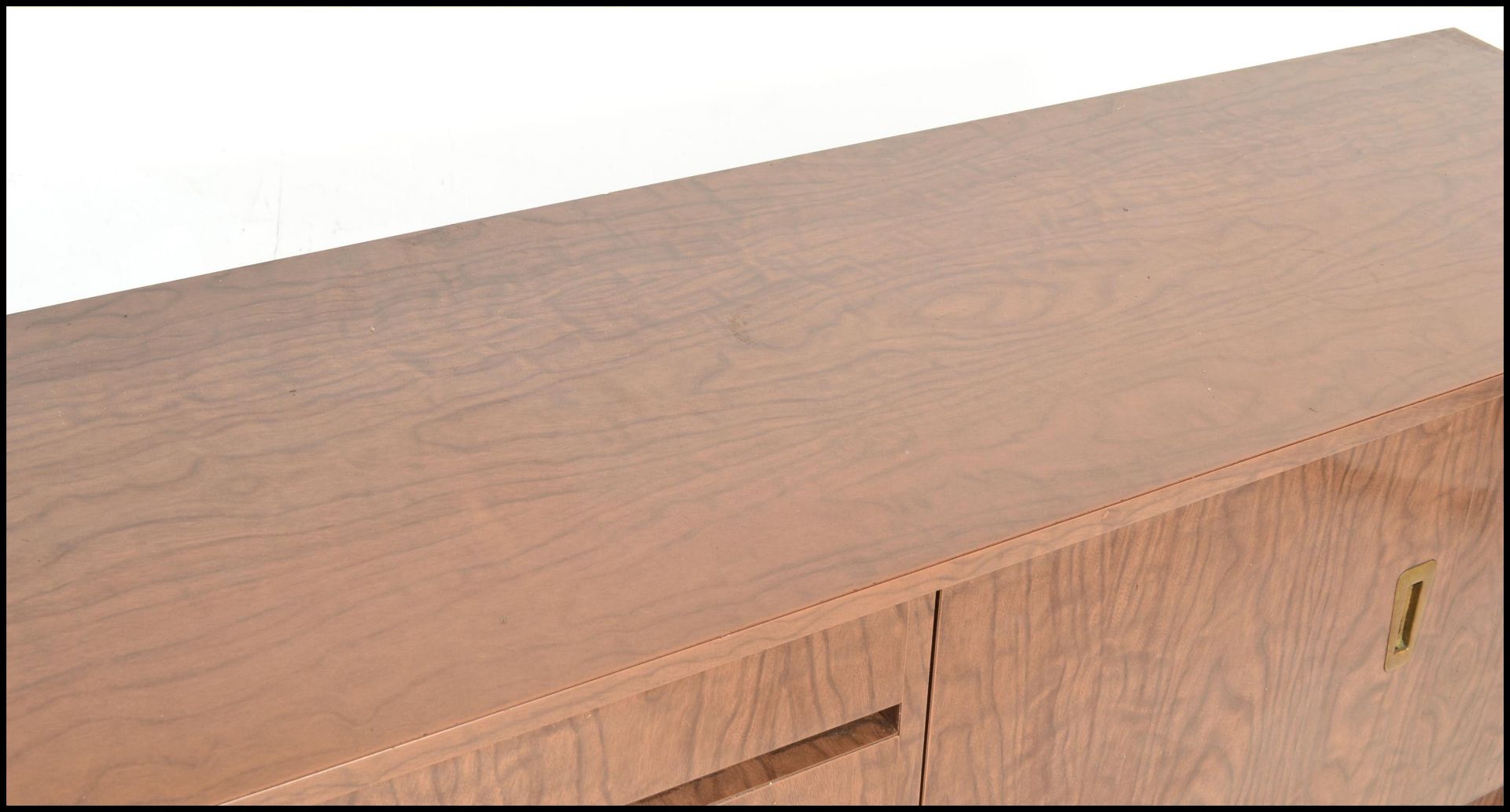 A mid century melamine sideboard credenza being raised on tapering legs with angled wide body - Image 2 of 7