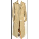 Burberry - a vintage ladies' classic trench coat with notched lapel collar and storm flap on the