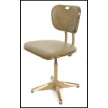 A mid century Industrial office swivel desk chair of metal construction in the manner of Tansad