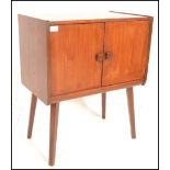 A retro 20th Century teak wood twin door recorded cabinet / cupboard having square handles with